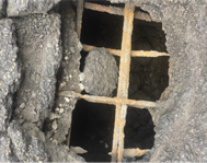 Photo of a hole in a concrete deck.