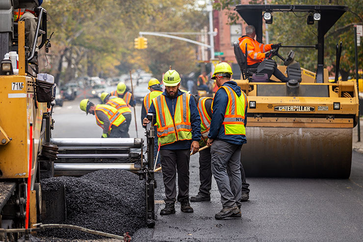 NYC DOT crews repave a roadway.