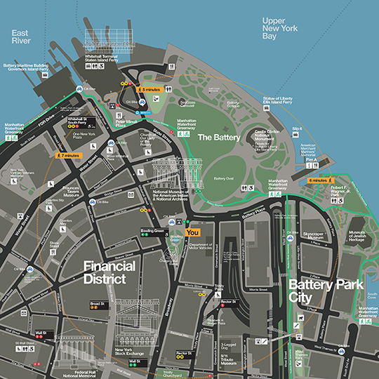 Colorful map of the Financial District in Lower Manhattan, shows where subway stations are located as well as other neighborhood amenities such as bike lanes, restrooms and historic landmarks