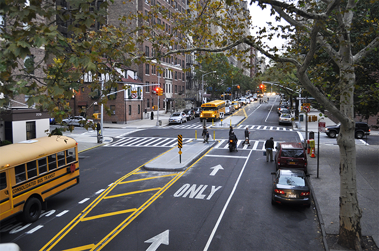 After Conditions: Pedestrians cross West End Avenue at W 95th Street via a newly constructed pedestrian refuge island that encourages slower, safer turns and shortens crossing distances.