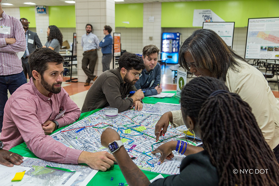 Attendees at a previous Cross Bronx Expressway workshop discuss the corridor with agency officials
