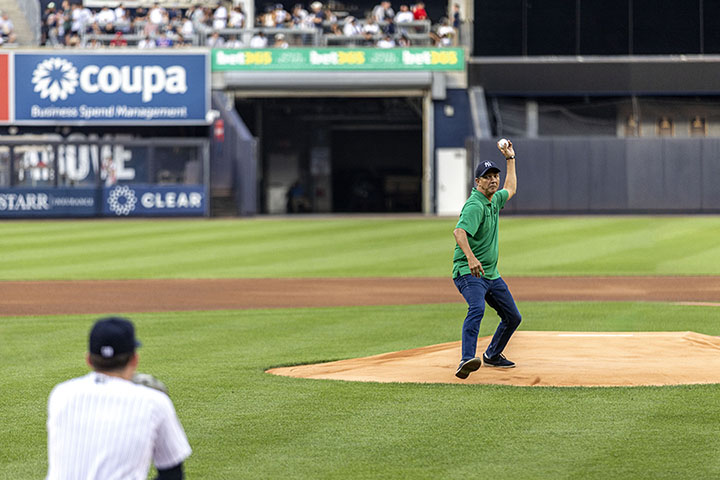 N Y C D O T Commissioner Ydanis Rodriguez throws the first pitch at a Yankees game