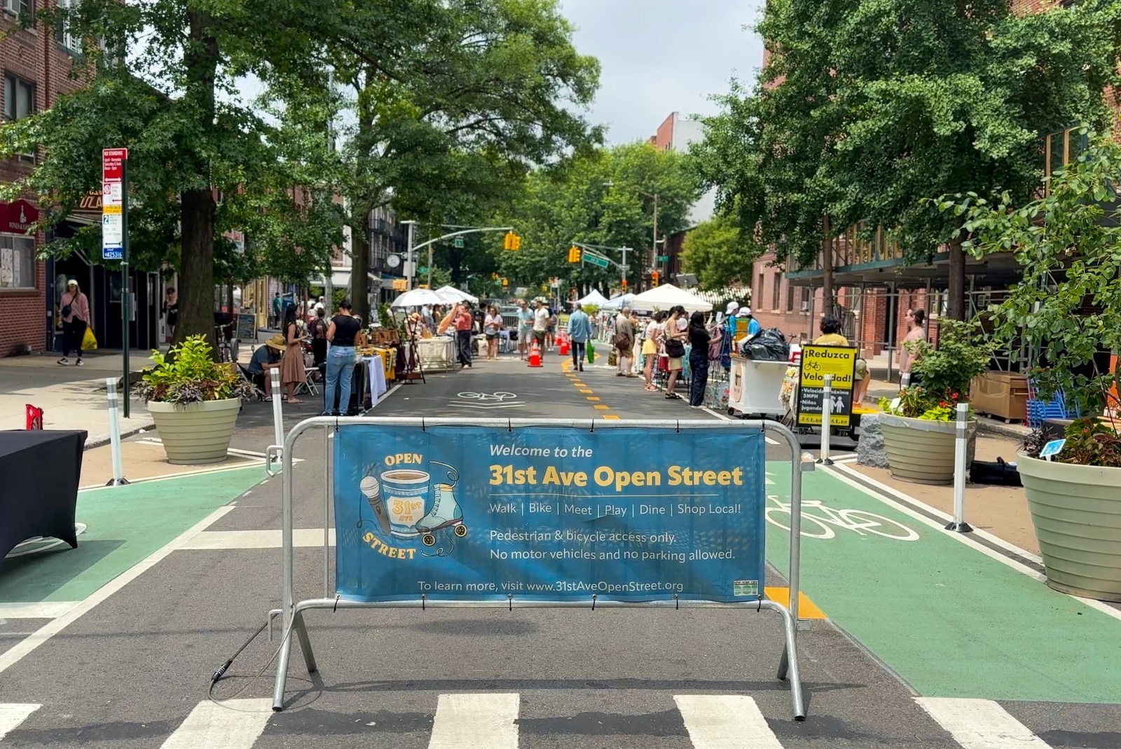 A shared streets design supports operations for the 31st Avenue Open Street by expanding pedestrian space with painted sidewalk extensions.