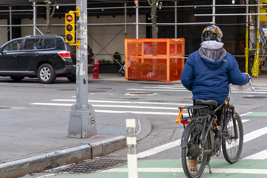 A bike rider photoed from back