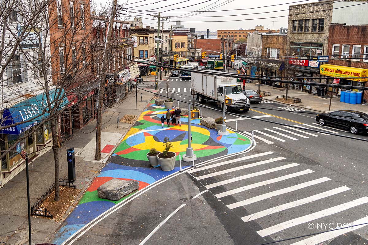 Public Access by Mollie Hosmer-Dillard is on display at the asphalt pedestrianized space of Corson Avenue and Victory Boulevard on Staten Island