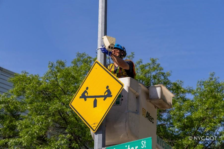 traffic Operations worker installing a new activity sensor