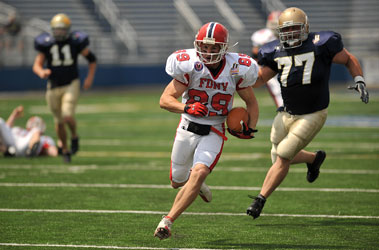 Firefighter Brian Vomero (E-247) runs into the end zone to score the second touchdown of the game. 