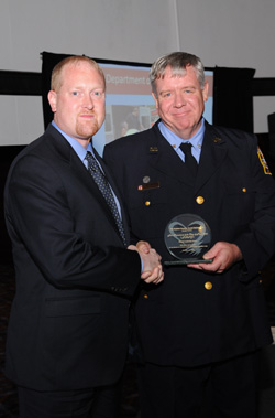 FDNY Dr. John Freese accepted the Sudden Cardiac Awareness Association 2009 Leadership Award from sudden cardiac arrest survivor and Washington, DC, firefighter Jim Soderberg.  
