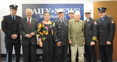 Dozens of friends and family members joined Lt. Kevin Flanagan when he received the New York Daily News Hero of the Month honors. (L to R) FF Dan Flanagan (E-58), Fire Commissioner Nicholas Scoppetta, Mary Ellen Flanagan, Lt. Kevin Flanagan (L-28), Battalion Chief Frank Donnelly (B-16), retired firefighter Tom Flanagan, Chief of Department Salvatore Cassano and FF Brian Flanagan (E-92).