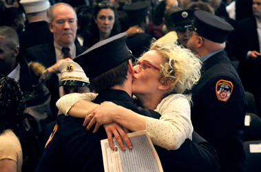 A paramedic is congratulated after the ceremony.