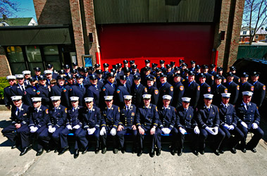 Members of Ladder 39 and Engine 63 in front of their quarters.