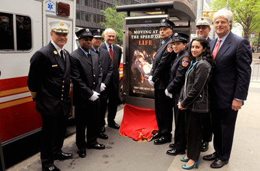 Fire Commissioner Nicholas Scoppetta and Chief of Department Salvatore Cassano swear in Michele (far right) and Alyssa Corley as honorary fire chiefs.