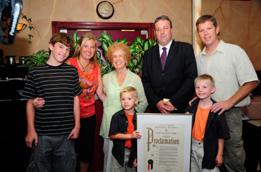 Lt. Chris Kane receives a Proclamation from Staten Island Councilman Kenneth Mitchell for saving the life of his neighbor, Joan Cupo. (L to R) Christopher Kane, 12; Florence Kane; Ms. Cupo; William Kane, 6; Councilman Mitchell; Timothy Kane, 7; and Lt. Kane.