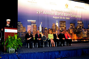 Chief of Department Salvatore Cassano addresses the crowd at the 21st Annual World Burn Congress in New York. On the dais, (L to R) Ronald Siarnicki, President of the Board Trustees for the Phoenix Society; Nicholas Scoppetta, Fire Commissioner; Dr. Laura Forese, Chief Medical Officer of NewYork-Presbyterian/Weill Cornell; Fabrizio Michelassi, M.D., Chair of Surgery for Weill Cornell Medical College; Firefighter Billy Leahy, President of the New York Firefighters Burn Center Foundation; and Amy Action, Executive Director of the Phoenix Society.
