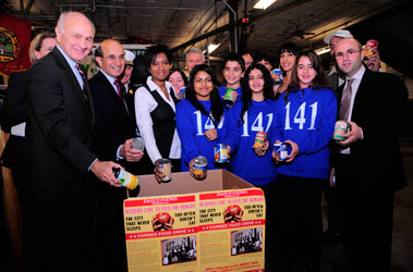 Fire Commissioner Nicholas Scoppetta and Chief of Department Salvatore Cassano join members of City Harvest, the New York Daily News, children from I.S. 141 and many others at the kick off for the "Daily News Readers Care to Feed the Hungry" food drive.