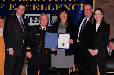 Kristin Eng (center), a Program Producer for the FDNY, receives her Public Service Award.