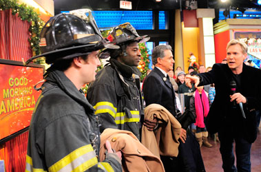 Good Morning America's weather anchor, Sam Champion (far right), talks to (L to R) Firefighter Edward Long, Firefighter Hisham Tawfiq and Lt. Anthony Mancuso.