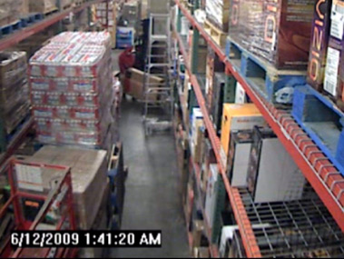 Surveillance cameras in the Target store stock room show Jared Devonish loading the televisions onto a cart.