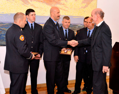 Members of Ladder 161 receive their awards from Rev. David Rider (right), President of the Lifesaving Benevolent Association.