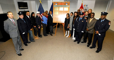 Family and friends gathered around the plaque following the ceremony.