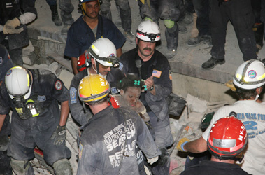 A 10-year-old girl is rescued by members of USAR NY Task Force 1 and a USAR team from Florida.