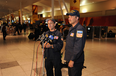 Rescue Battalion Chief Joe Downey and Deputy Inspector for the NYPD Robert Lukach address the media from JFK Airport following the return of New York Task Force 1.