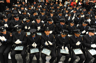 Seventy-seven new EMTs celebrate their graduation.