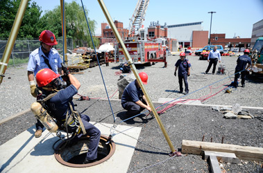 At the Fire Academy, firefighters demonstrate the use of the metal stokes basket and mechanical advantage equipment Ladder 2 used to rescue an injured construction worker on Feb. 10.