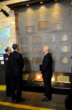 President Obama, Commissioner Cassano and Chief Joyce at the firehouse memorial wall.