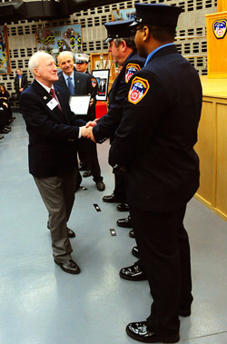 Survivor John Cummins thanks his FDNY EMS rescuers.
