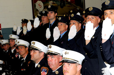 The new fire lieutenants take the oath of office.
