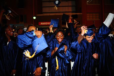 The graduates tossed their caps when the ceremony comes to a close.