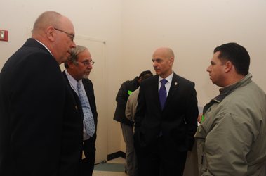 (L to R) Chief of Fire Prevention Thomas Jensen, Director of Public Certification and Education Steven Ertrachter, Fire Commissioner Salvatore Cassano and someone visiting the Licensing and Certification Center.