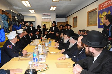 Rabbi Abe Friedman thanks more than 20 firefighters who attended the event.