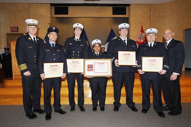Fire Commissioner Salvatore J. Cassano and Chief of Department Edward S. Kilduff join the members of the Electronic Fireground Accountability System staff who received the FDNY Administration Medal.