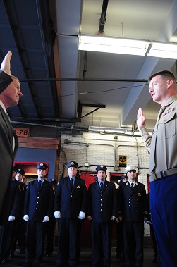 efighter Anthony Lombardo (right) reenlisted in the U.S. Marine Corps Reserves on Dec. 1, his father, Anthony Lombardo, Sr., (left) swore him in. Members of Engine 155 and Ladder 78 are in formation behind.