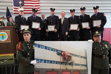 Firefighters from Ladder 163 with Mayor Michael Bloomberg and DSNY Commissioner John Doherty. A photo of the incident was held in front of the stage during the award presentation. Photo courtesy of Spencer T. Tucker.