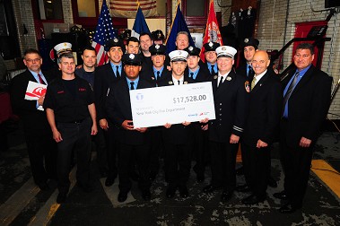 Members of Ladder 3 with representatives from Taylor & Taylor, Fireman's Fund and the Association of Independent Commercial Producers, who presented them and the FDNY High School with a grant to support training.