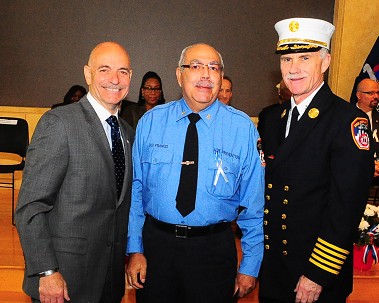 Fire Commissioner Salvatore Cassano and Chief of Department Edward Kilduff with David Franco, who is celebrating 35 years of service.