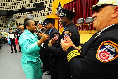 Cynthia Herbert, New York City teacher, reunites with her rescuers at the FDNY's 18th Annual Second Chance Brunch.