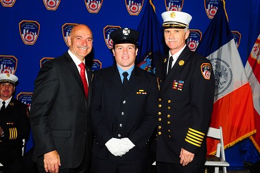 Lt. Christopher Ganci, whose father died on Sept. 11, 2001, moments after his promotion with Fire Commissioner Salvatore Cassano and Chief of Department Edward Kilduff.