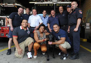 The Asaro family, Asaro the dog, and the members of Engine 54, Ladder 4, Battalion 9