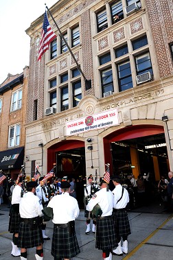 Pipers play to celebrate the firehouse's centennial.