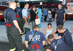 During the blackout, FDNY firefighters did so much than just fight fires. They opened their firehouses to the public and gave water to the thirsty during this hot summer day and night, offered refuge off the street and perhaps most important of all, provided reassurance and comfort to the frightened and the lonely. Photo by FF Chris Landano