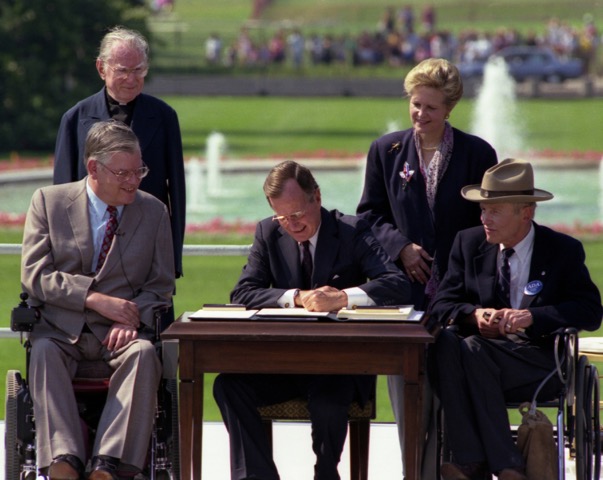 Photo of the signing of the Americans with Disabilities Act
