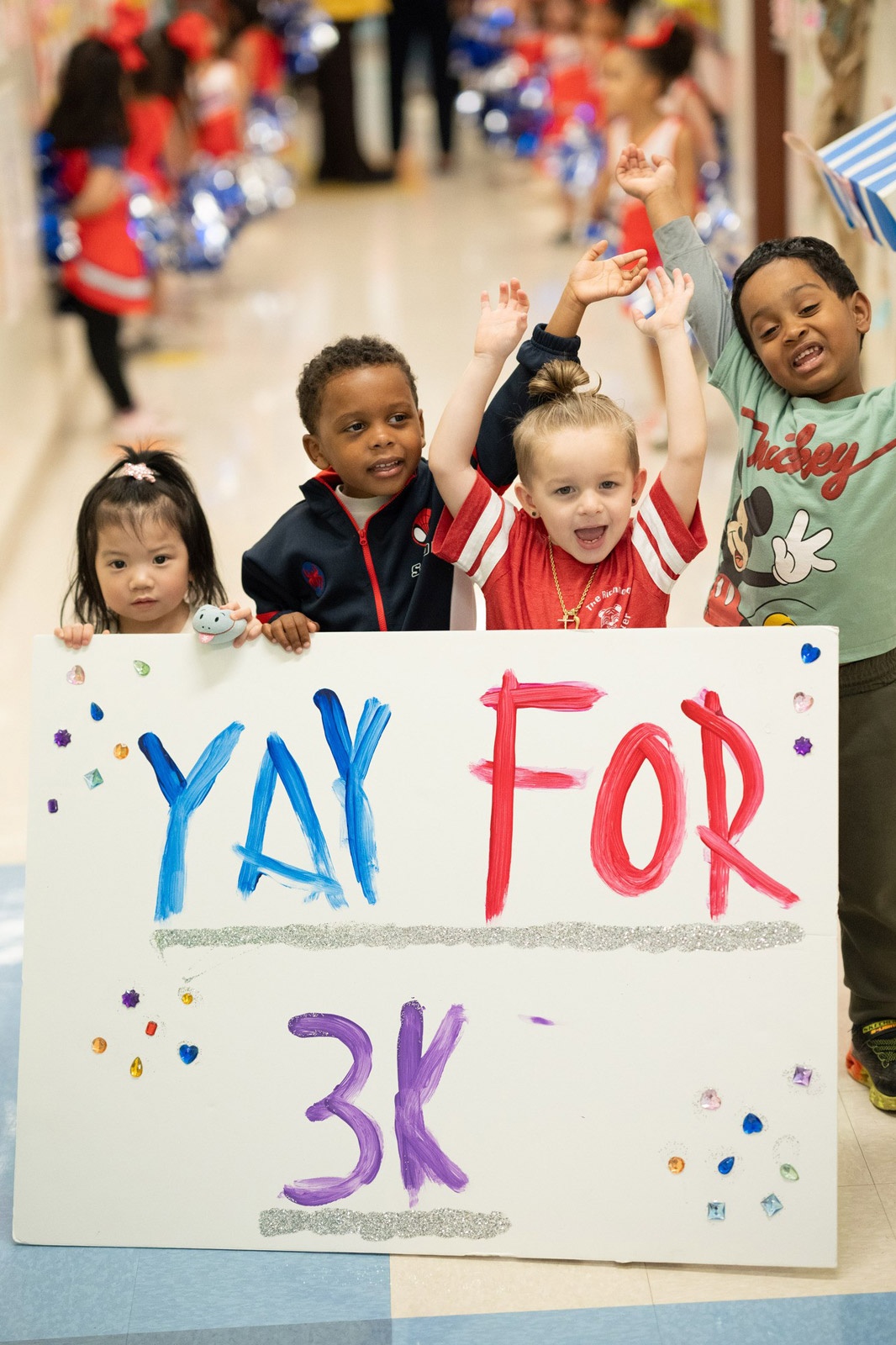 a group of kids are hold a card board