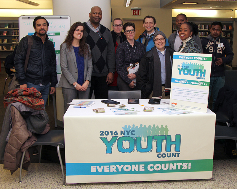 Volunteers staffing a table at the homeless youth count