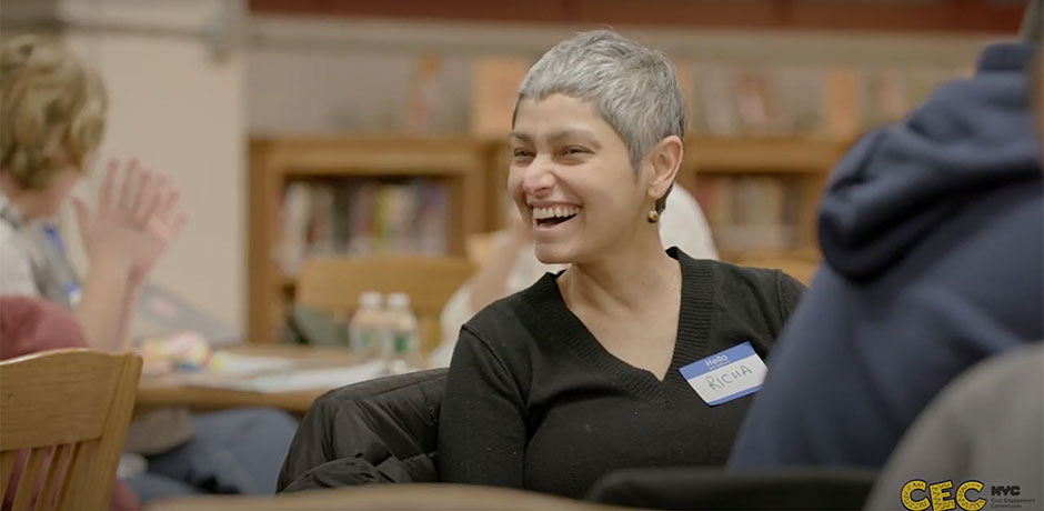 Screenshot from the video showing a woman smiling