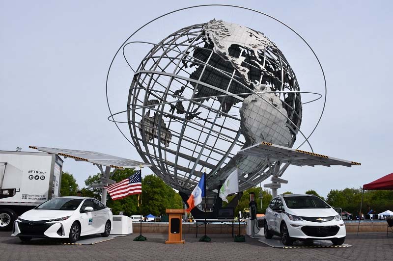 Solar Carports including two electric cars in front of the Unisphere at the annual NYC Fleet Show in Flushing Meadow Park 2017