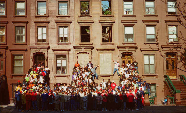 Photo of hip-hop artists gathered on Harlem stoop
                                           
